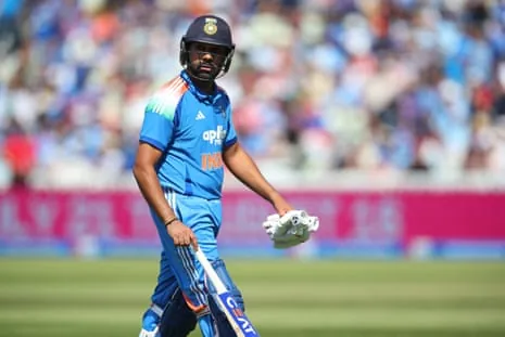 Rohit Sharma walks back to the pavilion after losing his wicket for 11.